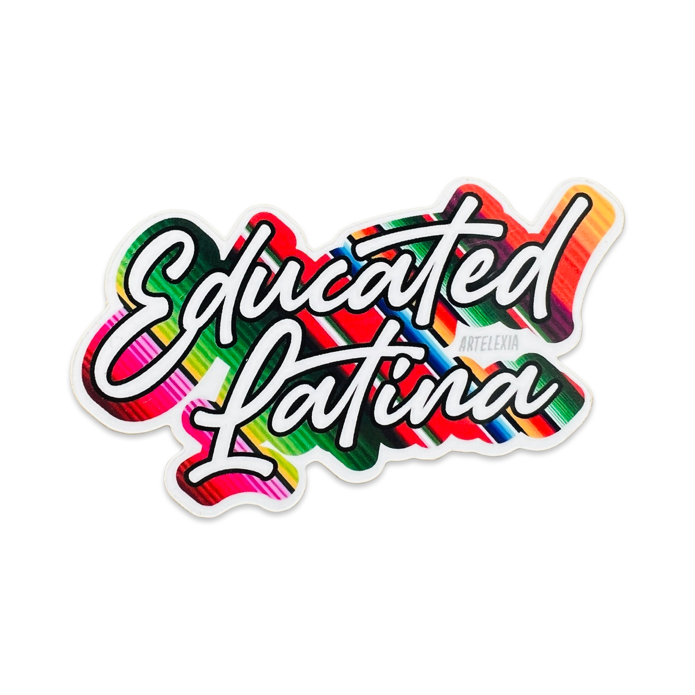 the phrase educated Latina in white lettering with a serape backgroud design