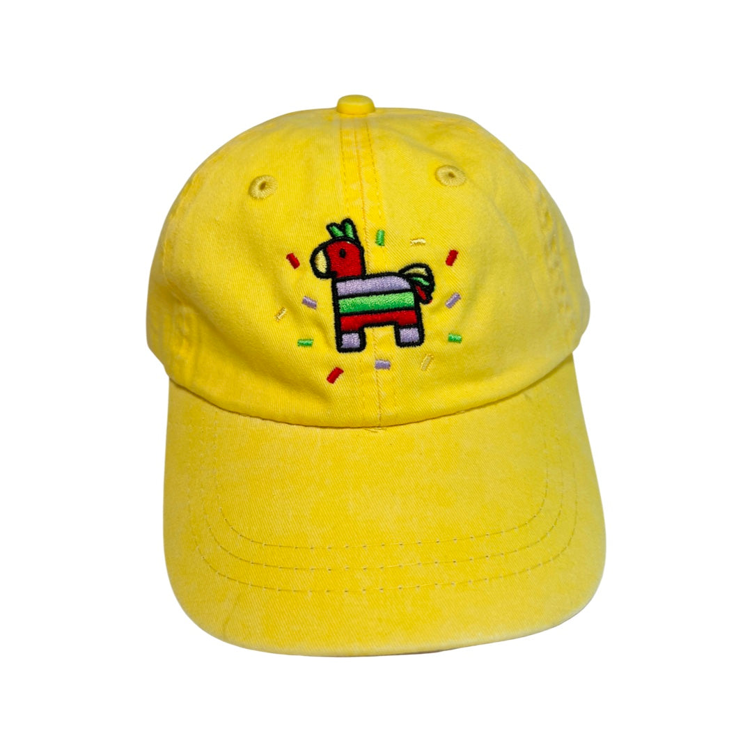 yellow kid's hat with an image of a colorful pinata