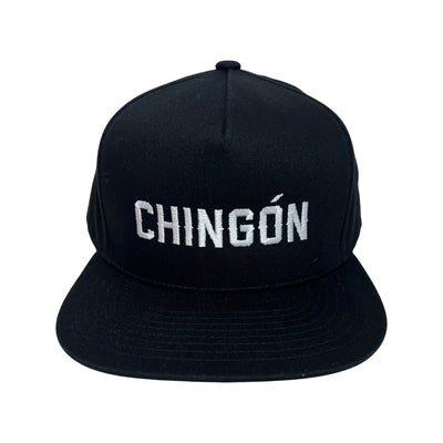 Black snap back hat with the word Chingon in white lettering
