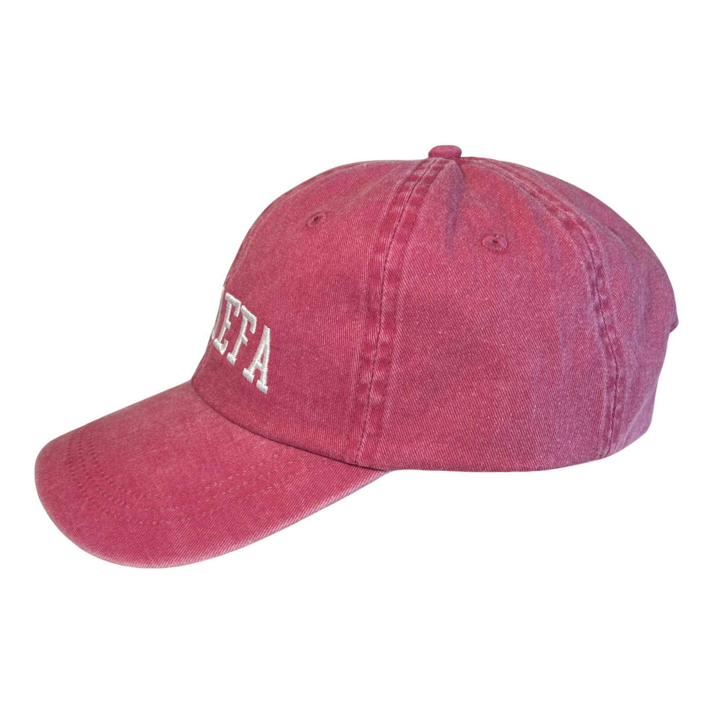 side view of a pink hat with the phrase La Jefa in white lettering