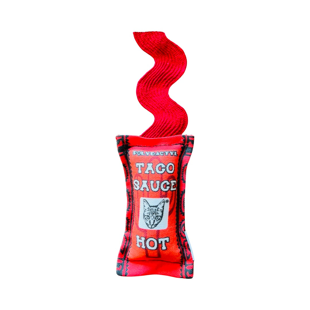 Red cat toy shaped like a hot sauce packet and features an image of a cat.