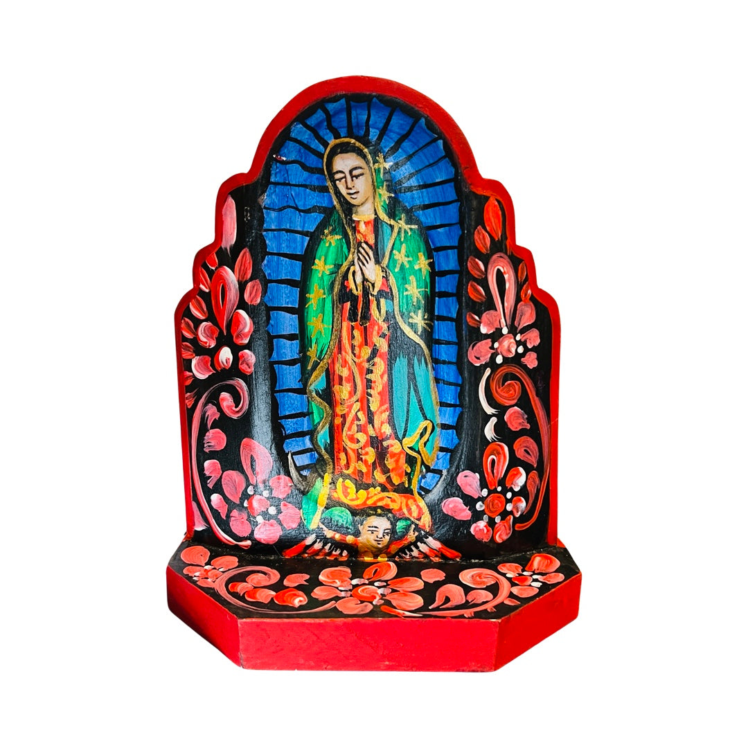 Virgin de Guadalupe wooden altar with an image of the VIrgin Mary featuring a border of flowers