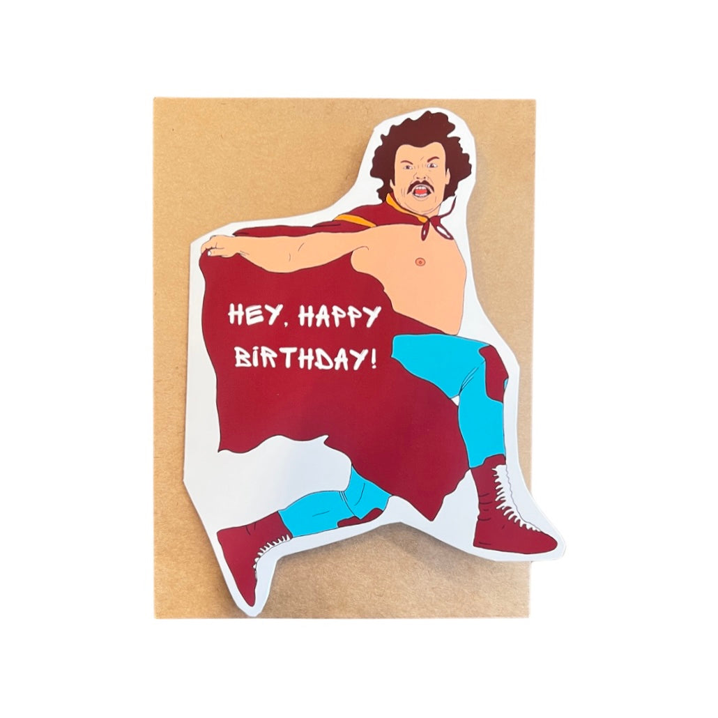 a white card shaped as Nacho Libre on top of a kraft brown envelope and the phrae Hey, Happy Birthday in whtie lettering on his cape.