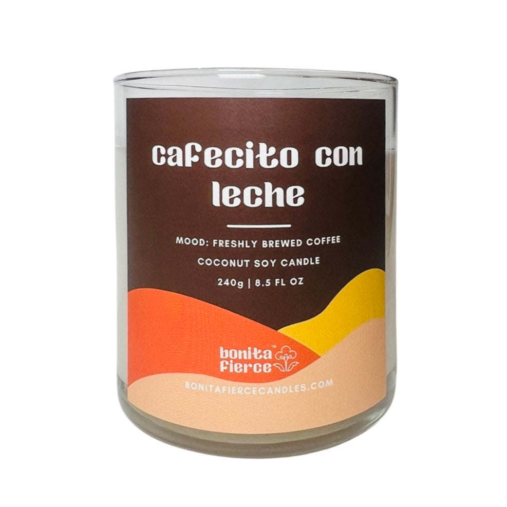 8.5 OZ glass cafecito con leche candle with a branded label in shades of brown and orange