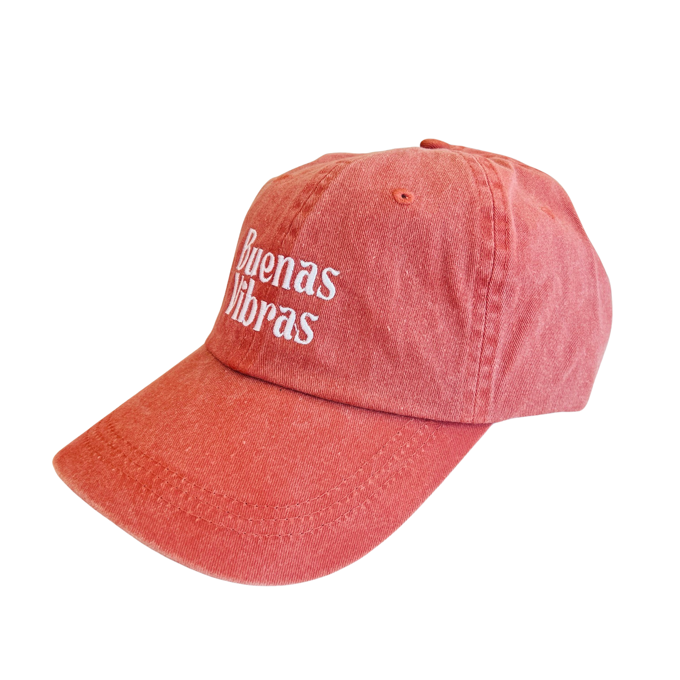 side view of a coral hat with the phrase Buenas Vibras in white lettering