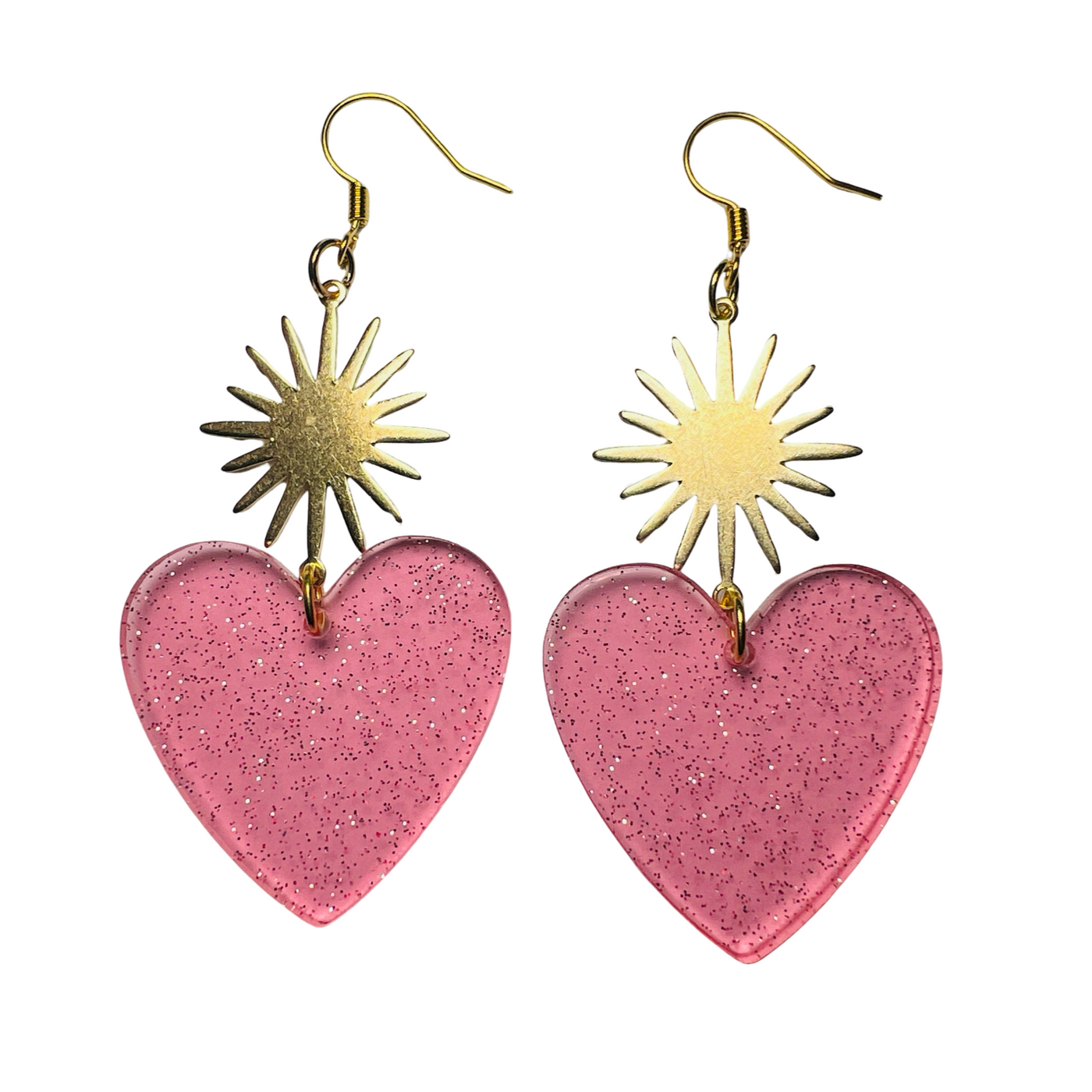 set of pink glitter resin heart earrings with a brass sunburst