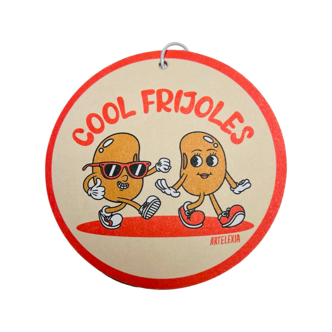 Round beige freshener with an orange border and features two cartoon beans and the phrase Cool Frijoles in orange lettering.