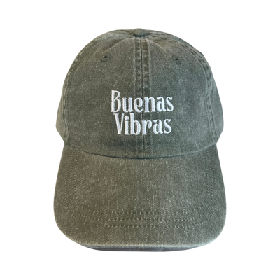 front view of a olive hat with the phrase Buenas Vibras in white lettering