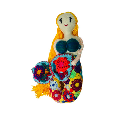 front view of an embroidered mermaid doll that features flowers on her tail