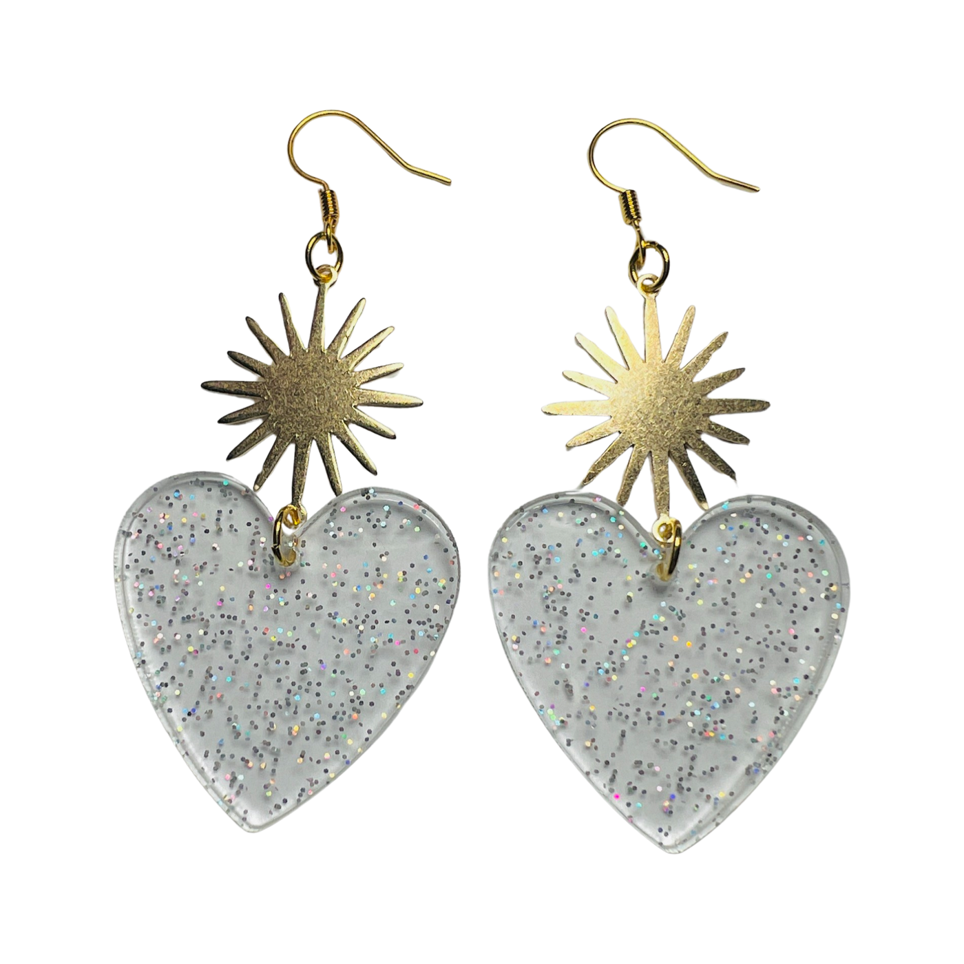 set of clear glitter resin heart earrings with a brass sunburst