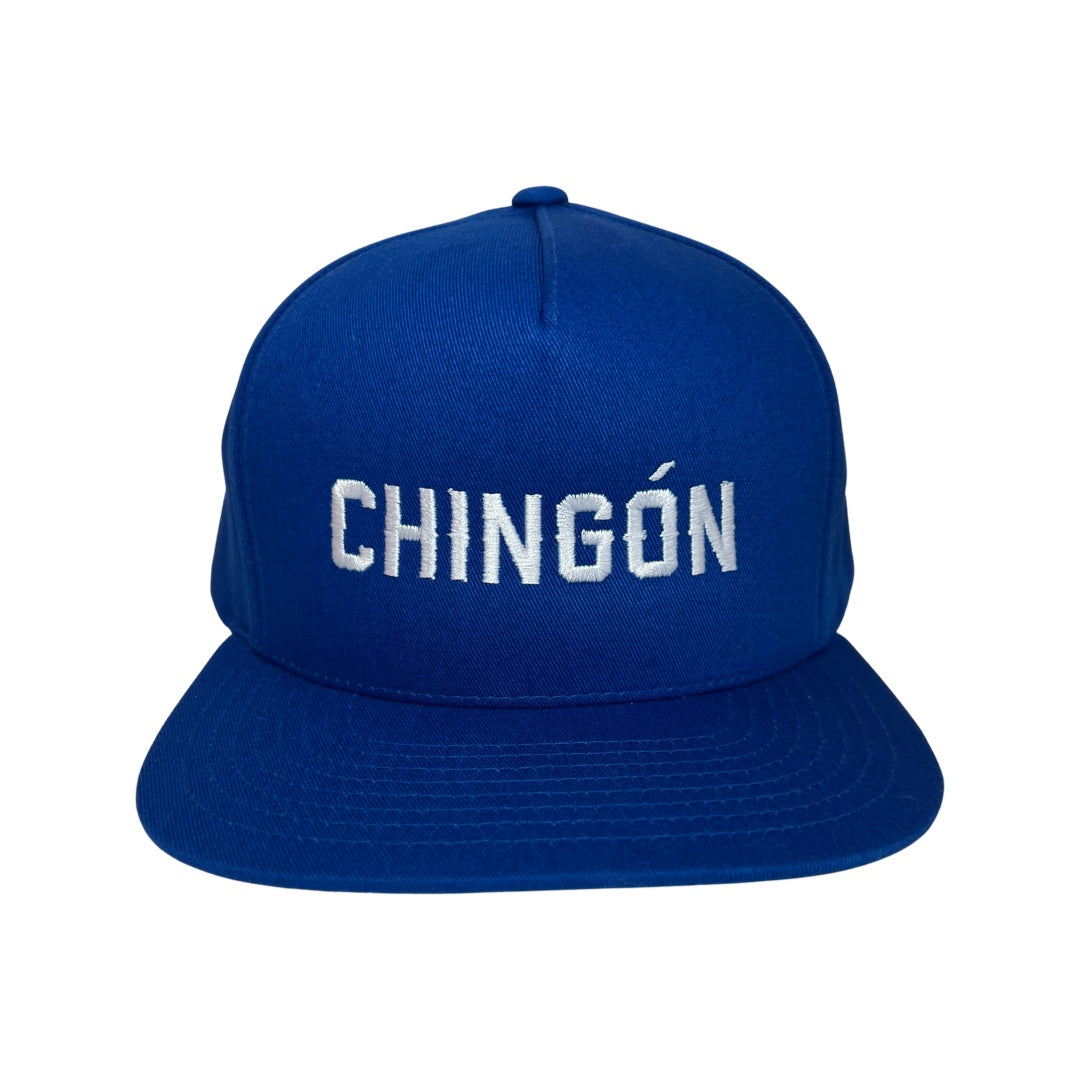 Blue snap back hat with the word Chingon in white lettering