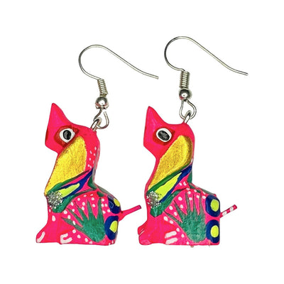A set of alebrije dog earrings of various colors and design