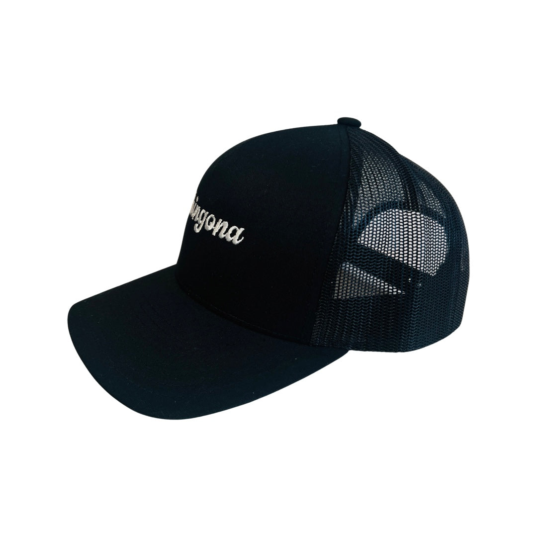 Side view of a Black mesh snap back hat with the phrase Chingona in white lettering