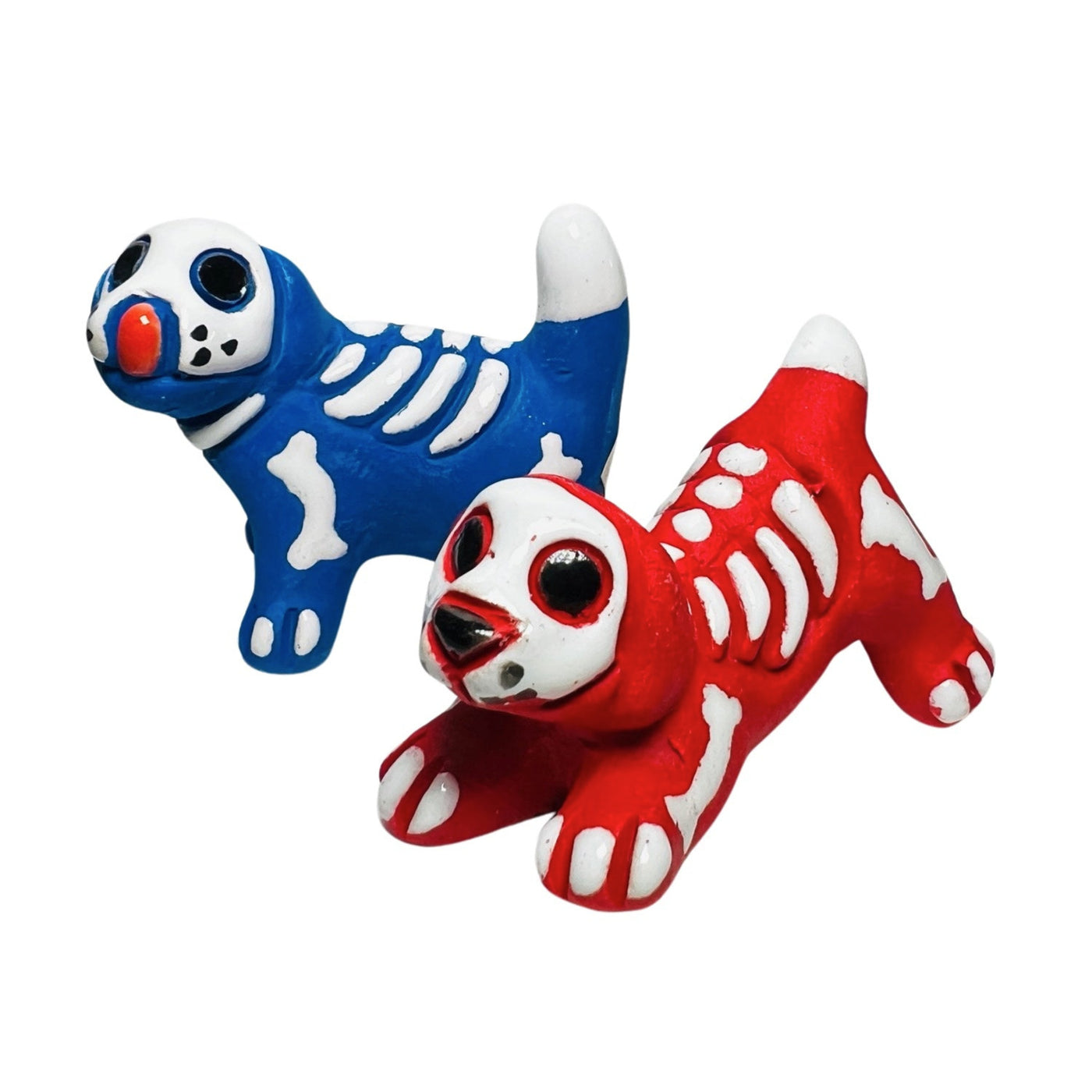 set of ceramic skeleton dogs; one red and one blue.