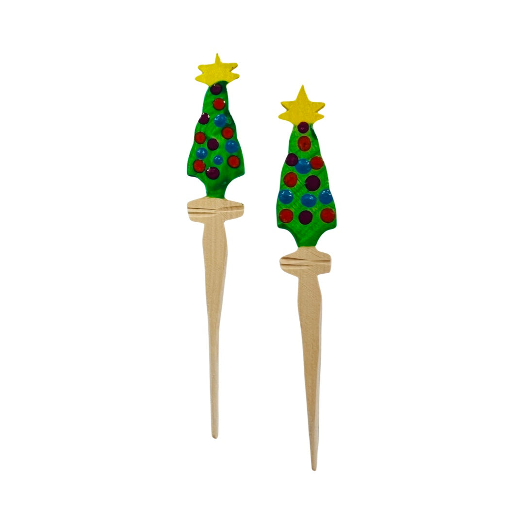 set of wooden toothpicks painted as christmas trees.
