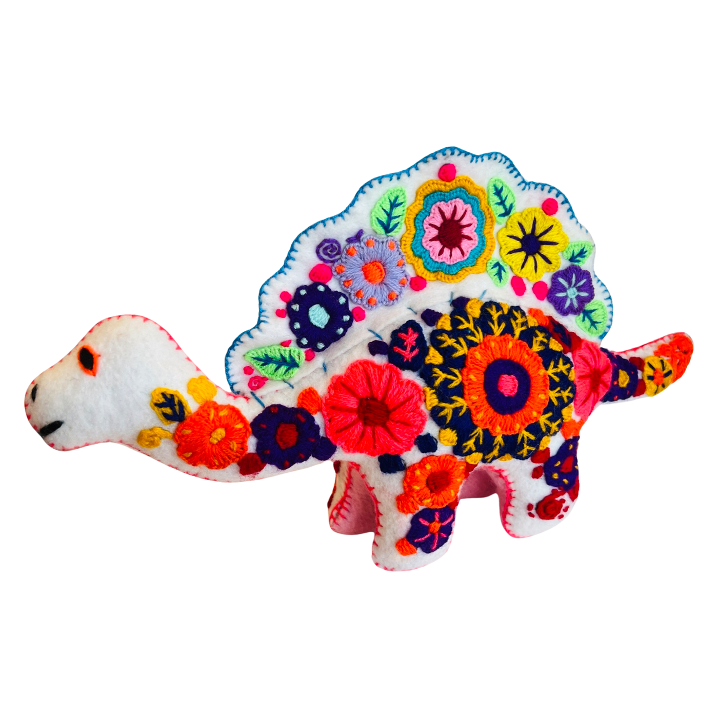 side view of an embroidered white dinosaur with colorful flowers