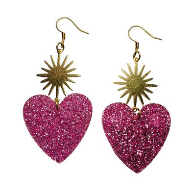 set of hot pink glitter resin heart earrings with a brass sunburst
