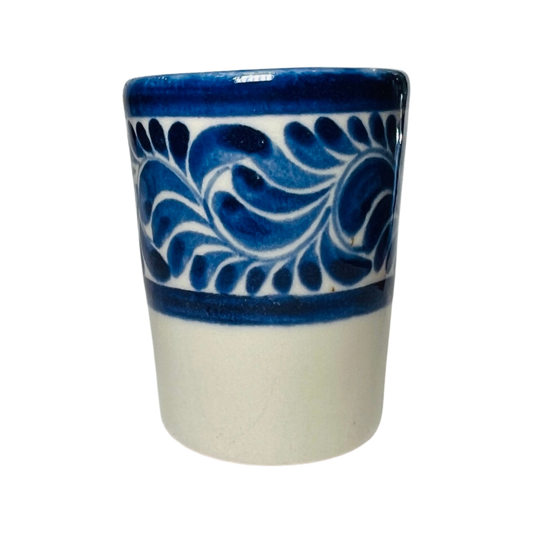 Blue and cream stoneware shot glass with a blue design
