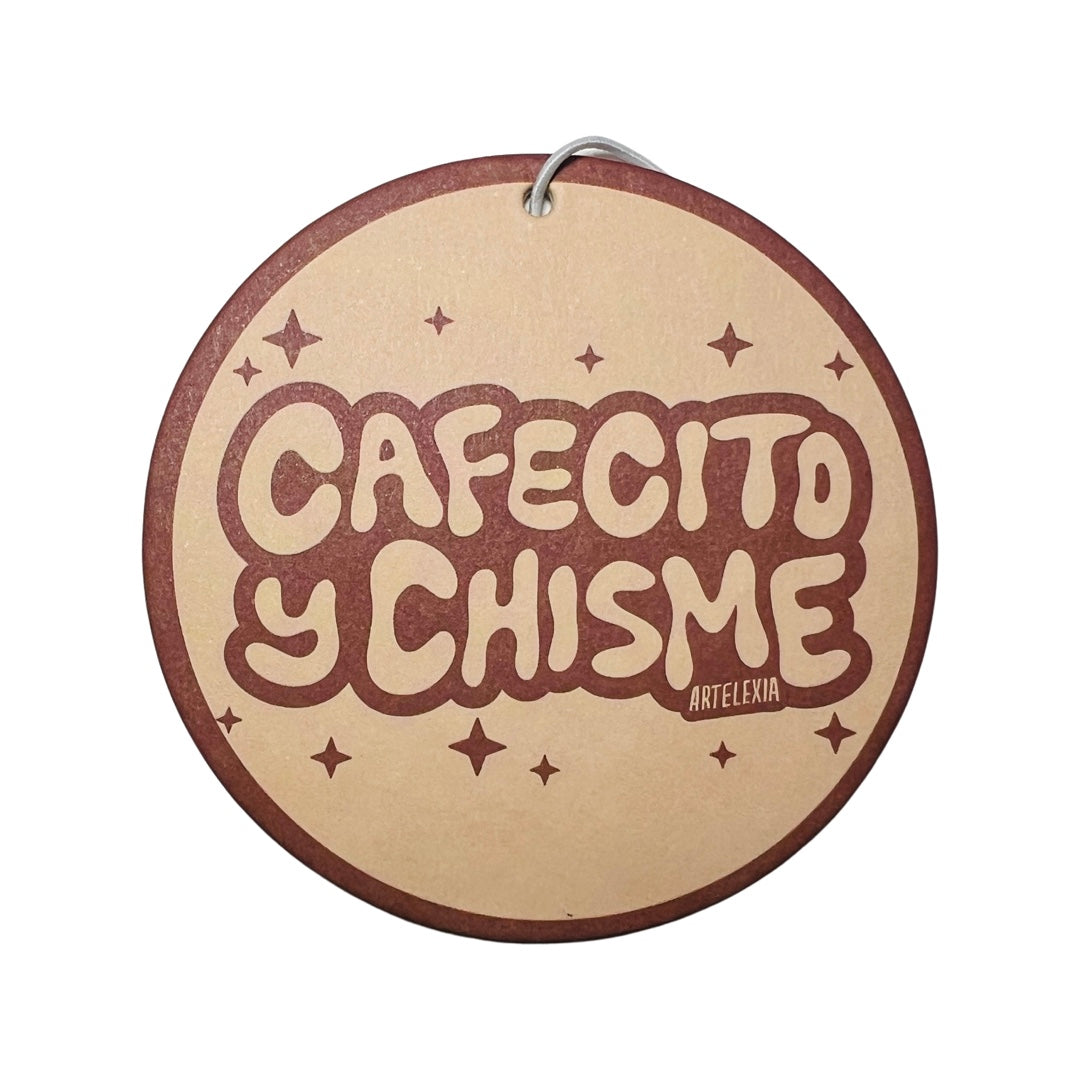 Round brown air freshener with the phrase Cafectio y Chisme in dark brown lettering