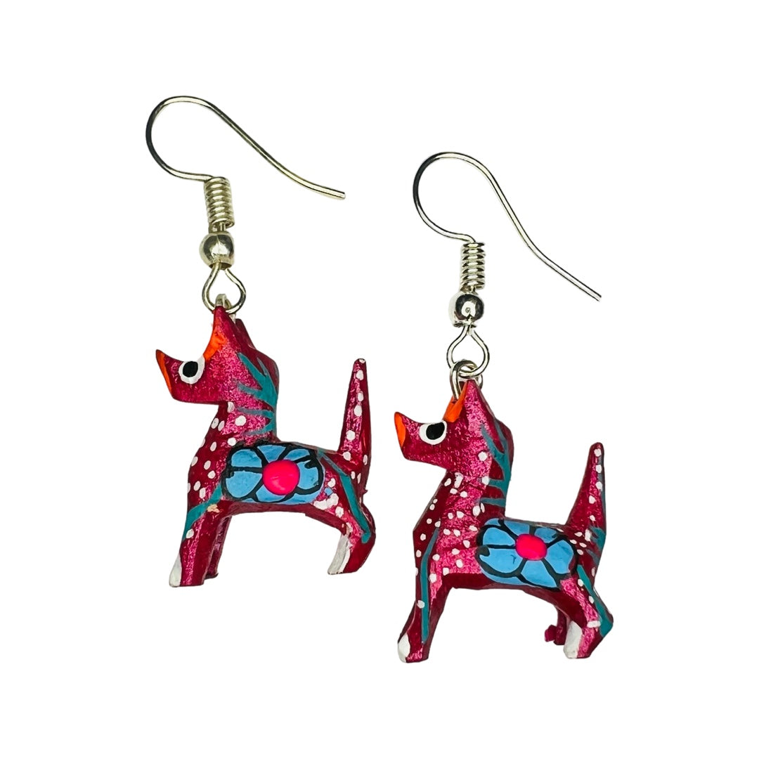 A set of alebrije dog  earrings of various colors and design