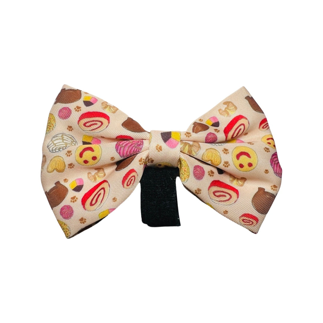 Light yellow dog bowtie featuring images of pan dulce