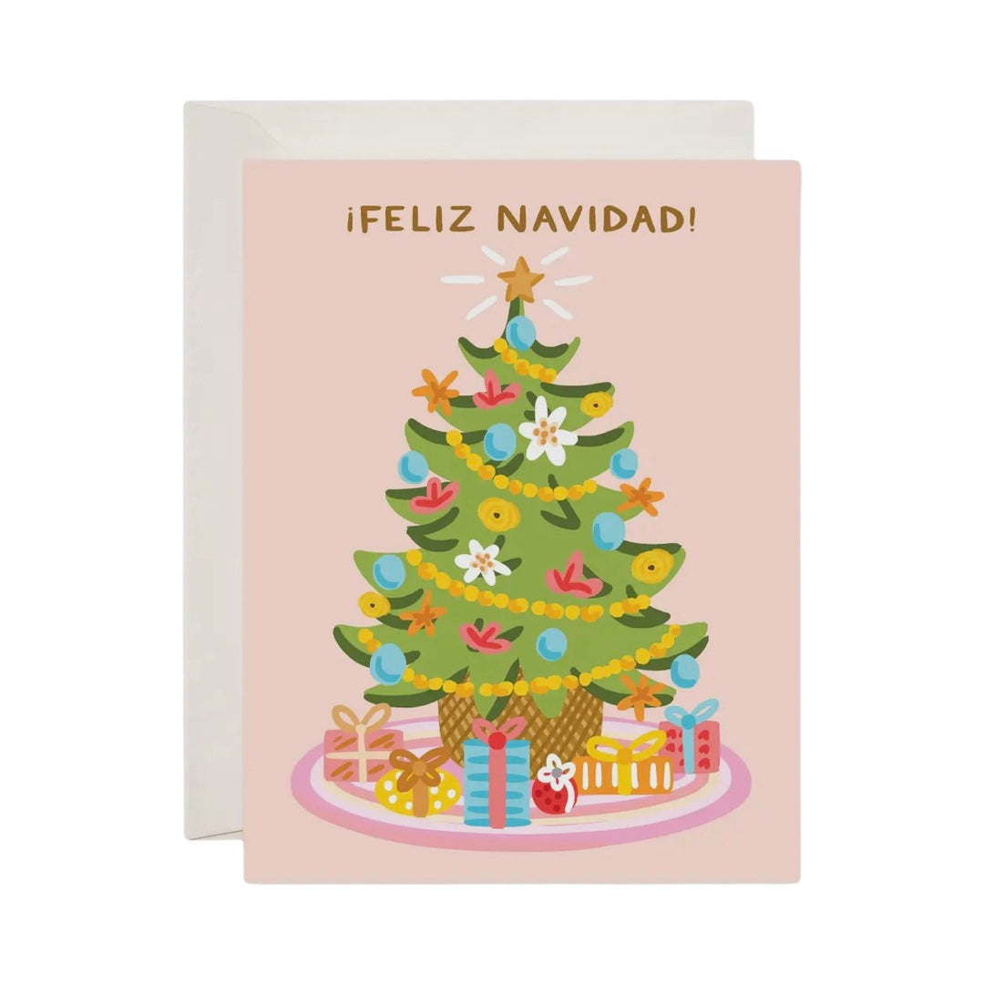 blush card with an illustration of a colorful christmas tree and the phrase Feliz Navidad in gold lettering.