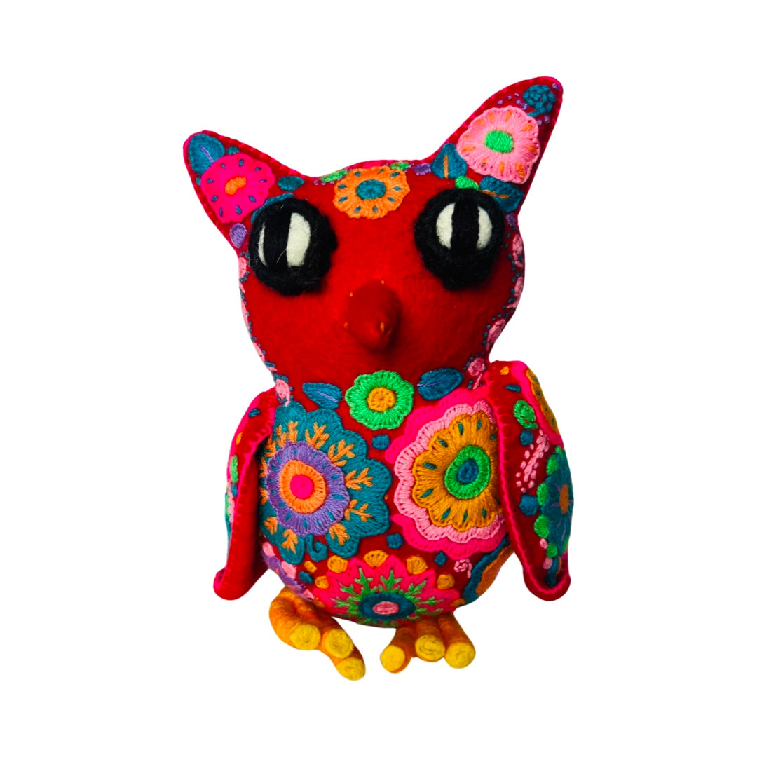 front view of a red embroidered owl with colorful flowers.