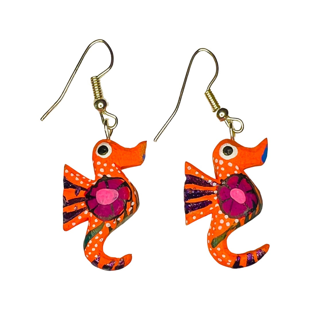 A set of alebrije seahorse earrings of various colors and design