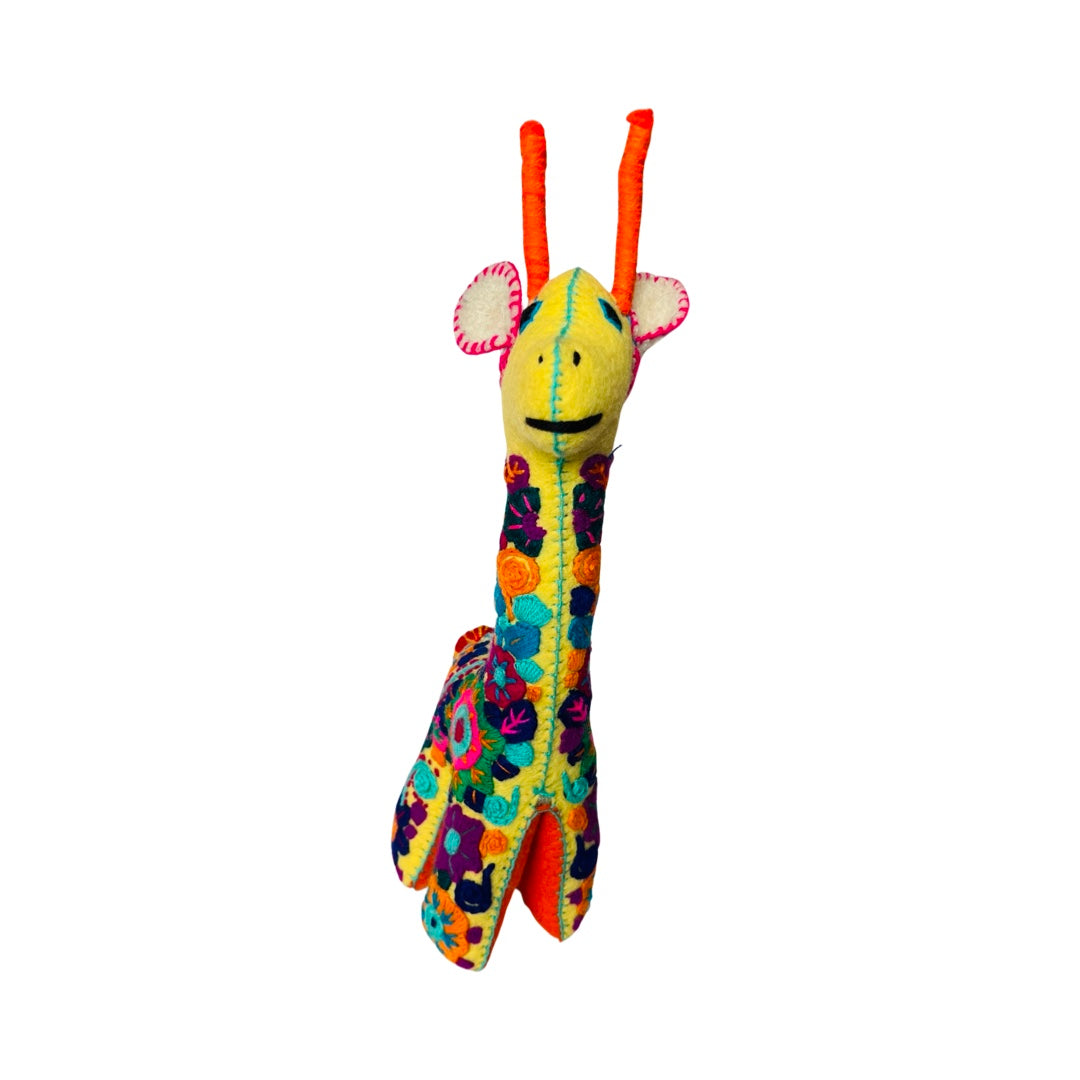 Front view of a yellow embroidered giraffe with colorful flowers