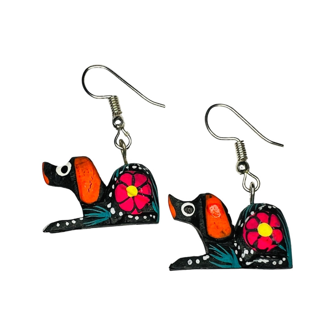 A set of alebrije dog earrings of various colors and design