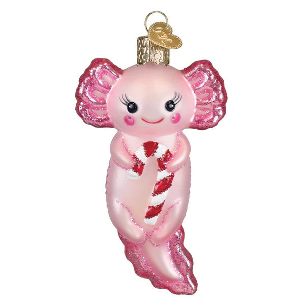 Pink glass axolotl ornament with glittery fins holding a red and white candy cane.