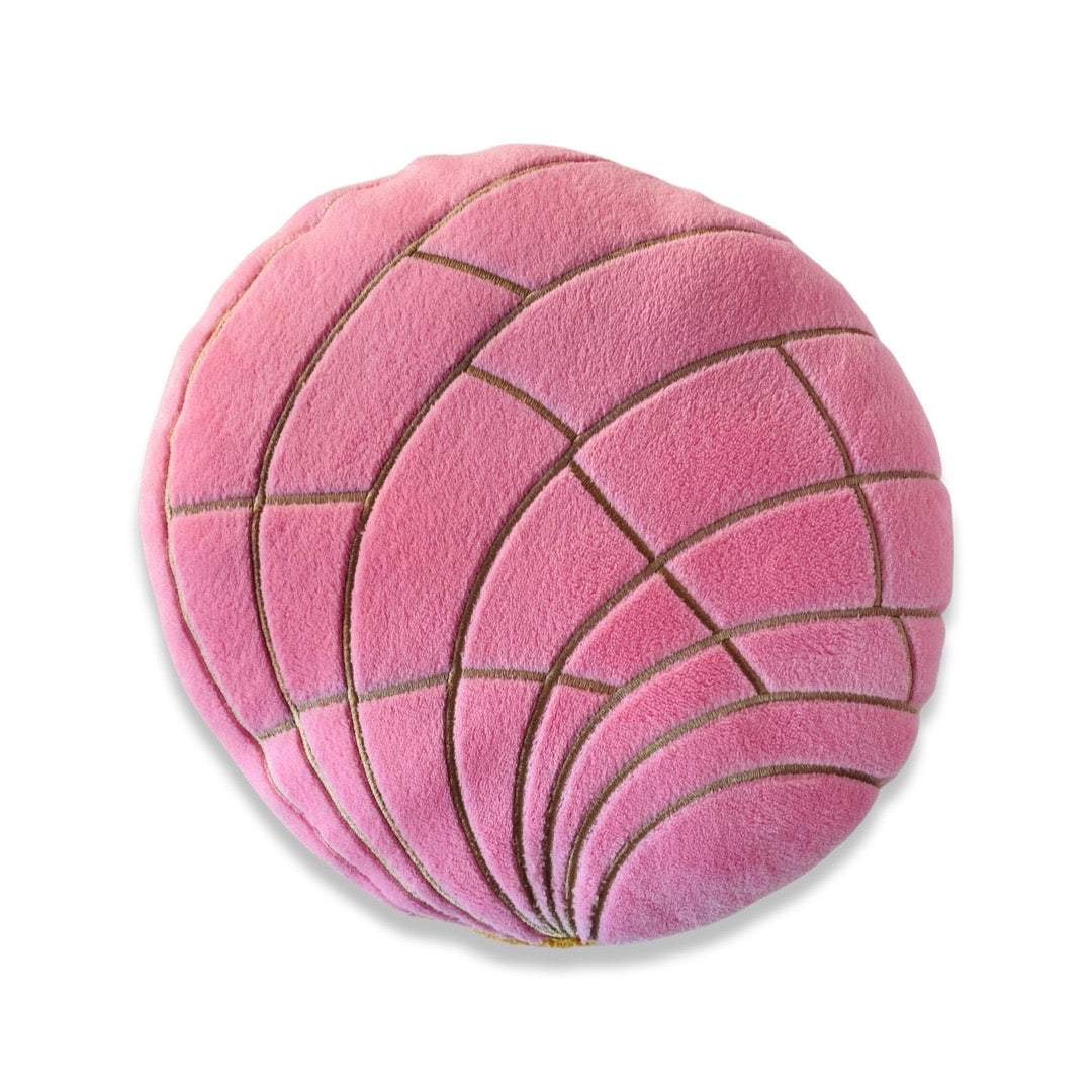 Plush concha (pan dulce/sweet bread) pillow in pink.