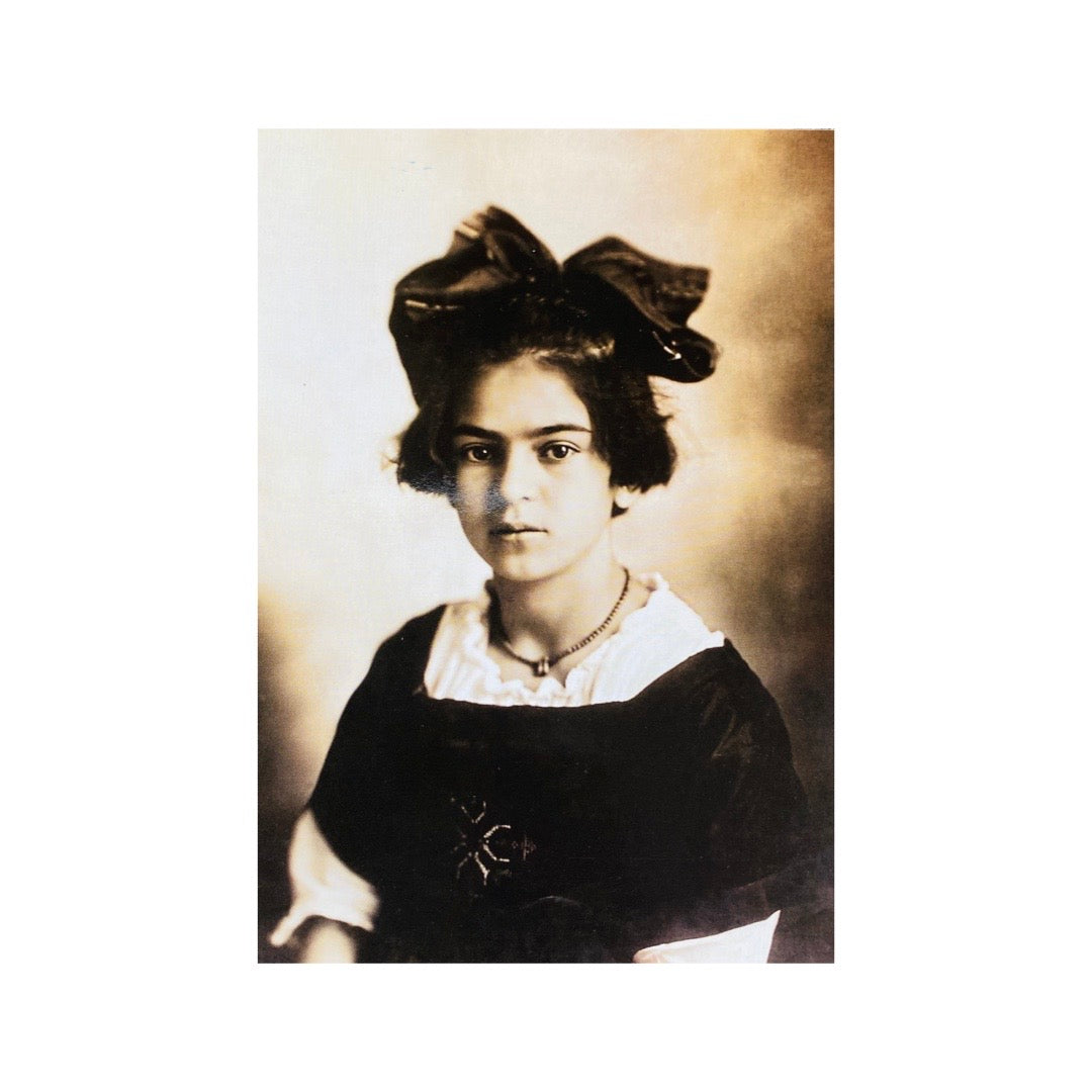 Vintage black & white photograph of Frida Kahlo as a child postcard.