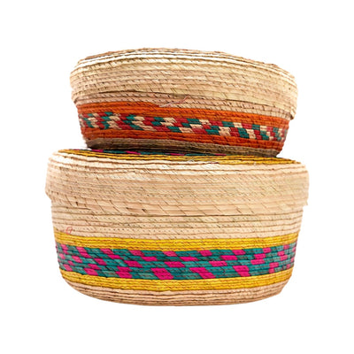 Side view of small woven tortilla basket on top of large woven tortilla basket (to compare sizes).