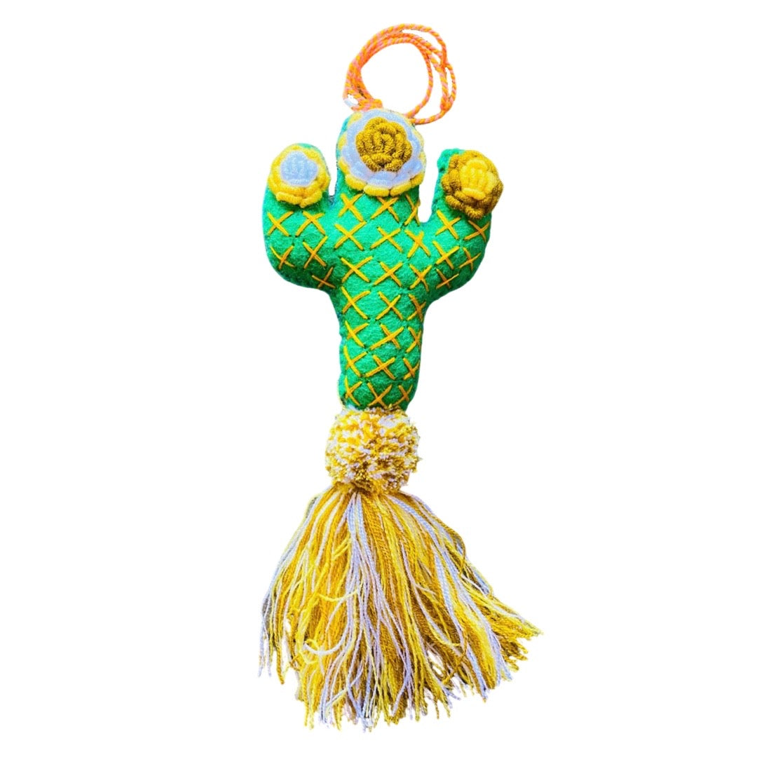 Green , white and yellow felt cactus featuring a pom pom and tassle.