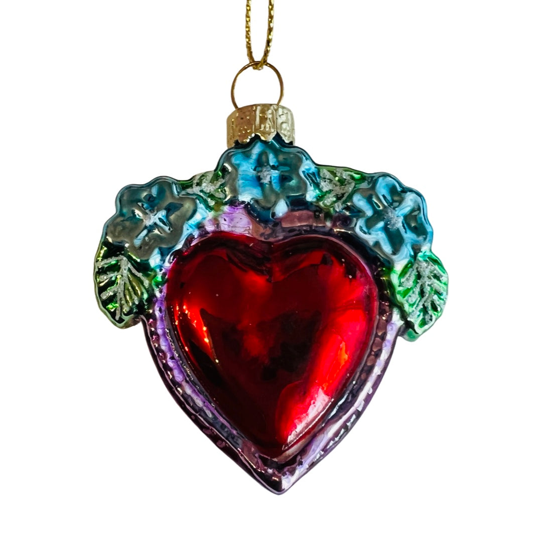 Glass Milagro Heart ornament (style 4). Milagro heart is red with pink border, along with blue flowers and green leaf petals.