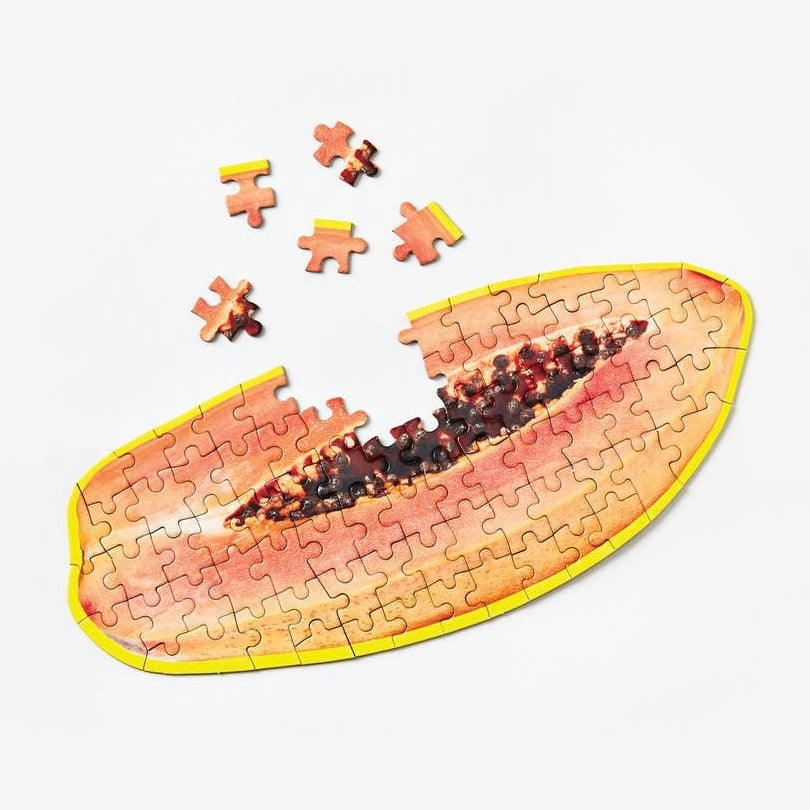 Photo of a partially assembled papaya puzzle 