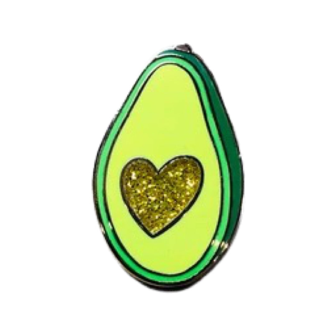 Avocado enamel pin featuring gold glitter heart in the center