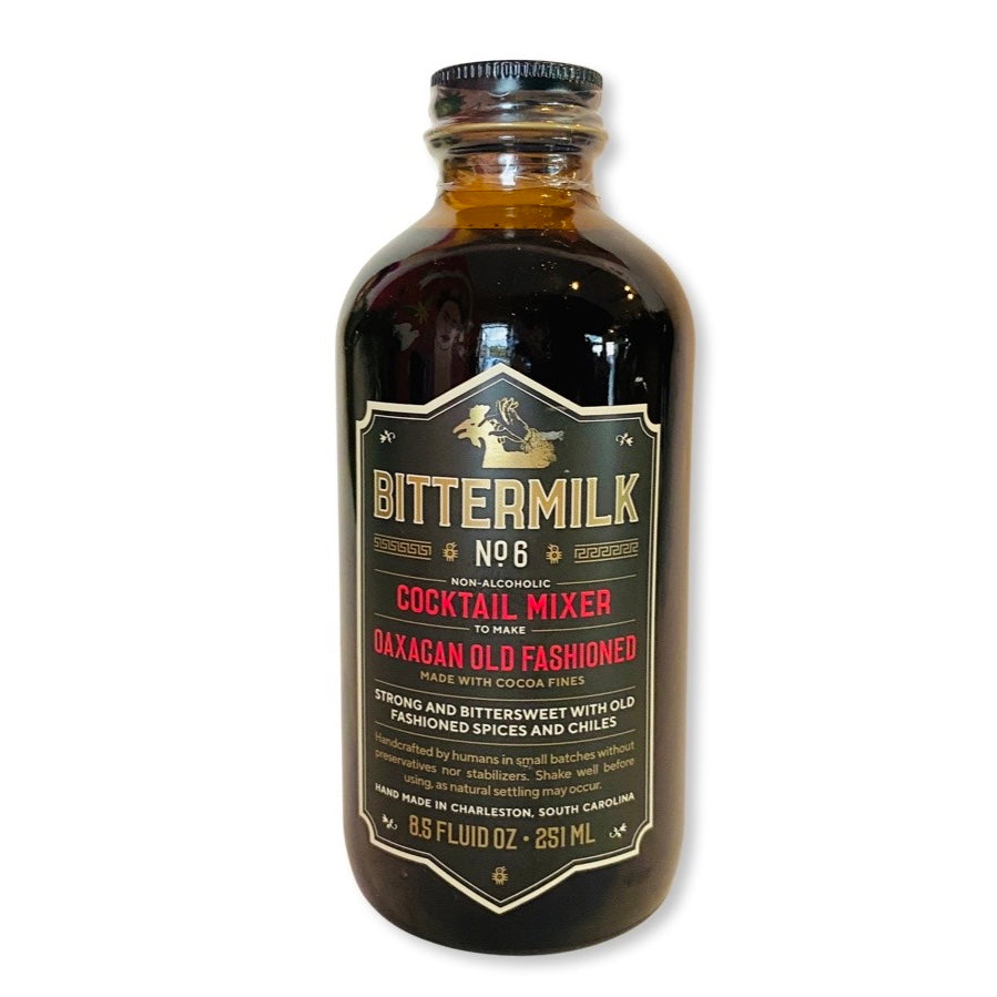 Bittermilk No. 6 Oaxacan Old Fashioned Cocktail Mixer in clear branded bottle with cap.