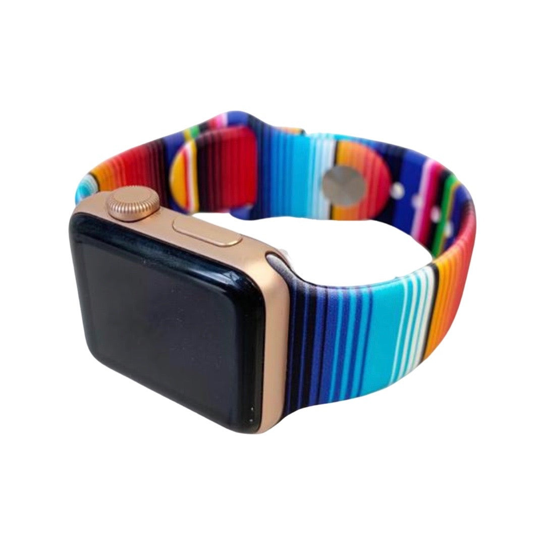 Multicolored serape silicon watch band featured on an apple watch. 