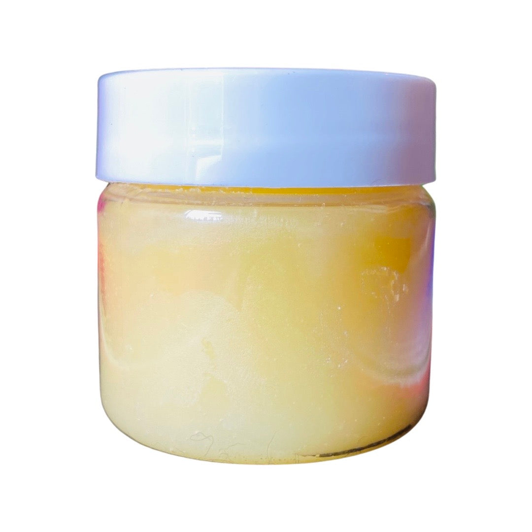 Side view of mango lip scrub in jar with lid.