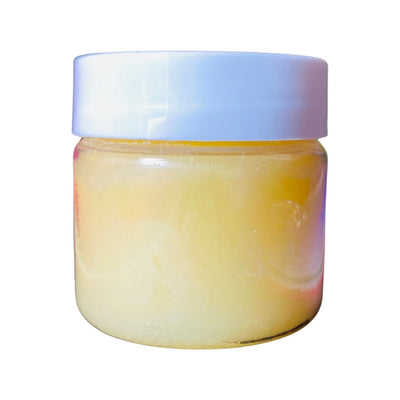 Side view of mango lip scrub in jar with lid.
