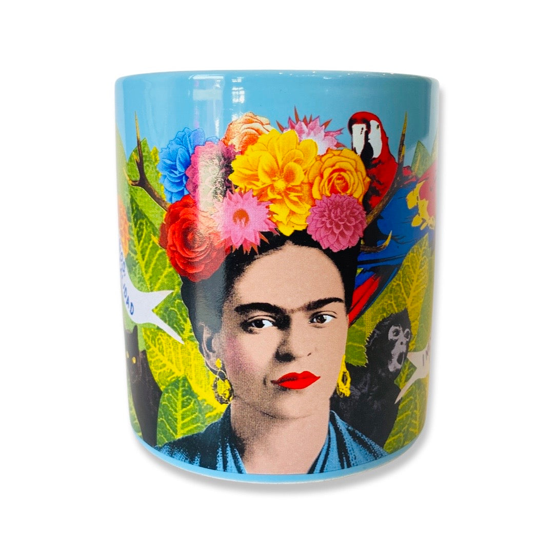 Blue Frida Dream mug featuring Frida Kahlo wearing a colorful flower crown surrounded by green leafs and animals. 