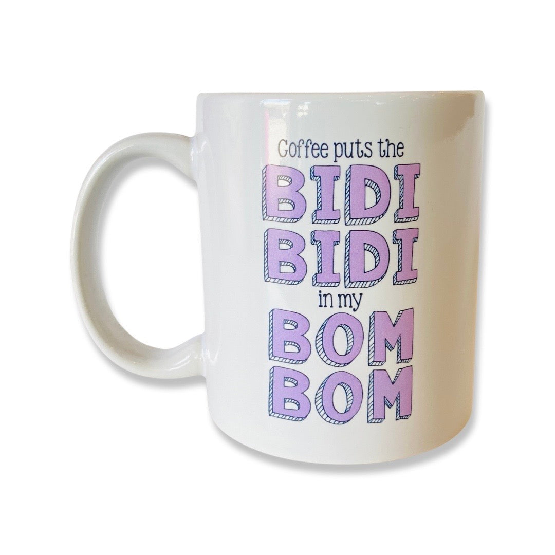 White mug with pink lettering reads, "Coffee puts the Bidi Bidi in my Bom Bom."