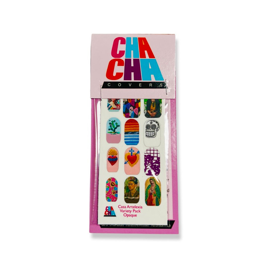Package of nail decals featuring various designs such as flowers, milagro hearts, skulls, Frida and the Virgin Mary.