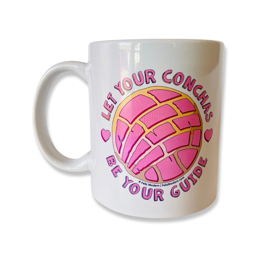 "Let Your Conchas Be Your Guide" phrase mug with pink concha design.