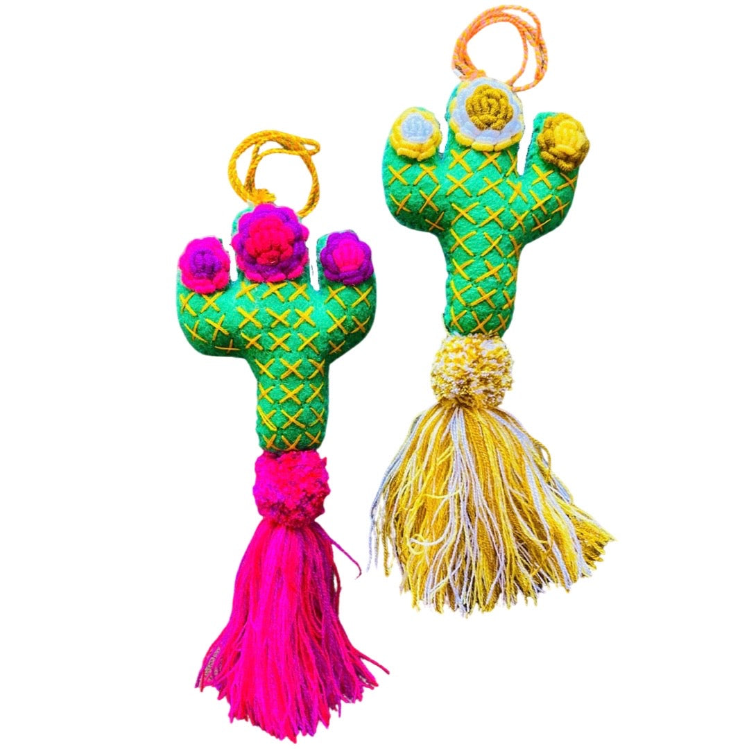 Two felt cacti featuring a pom pom and tassle