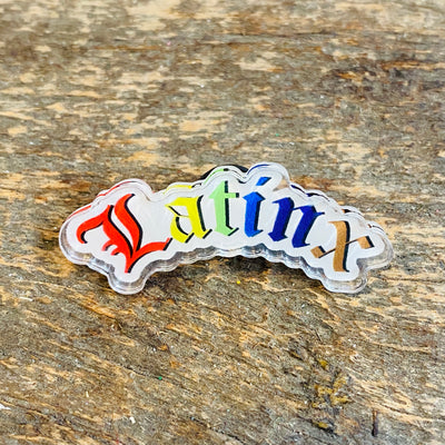 Latinx phrase rainbow pride pin.