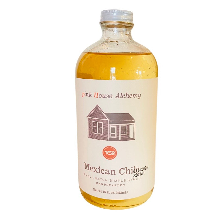 front view of Mexican Chile Simple Syrup in branded clear bottle with cap. 