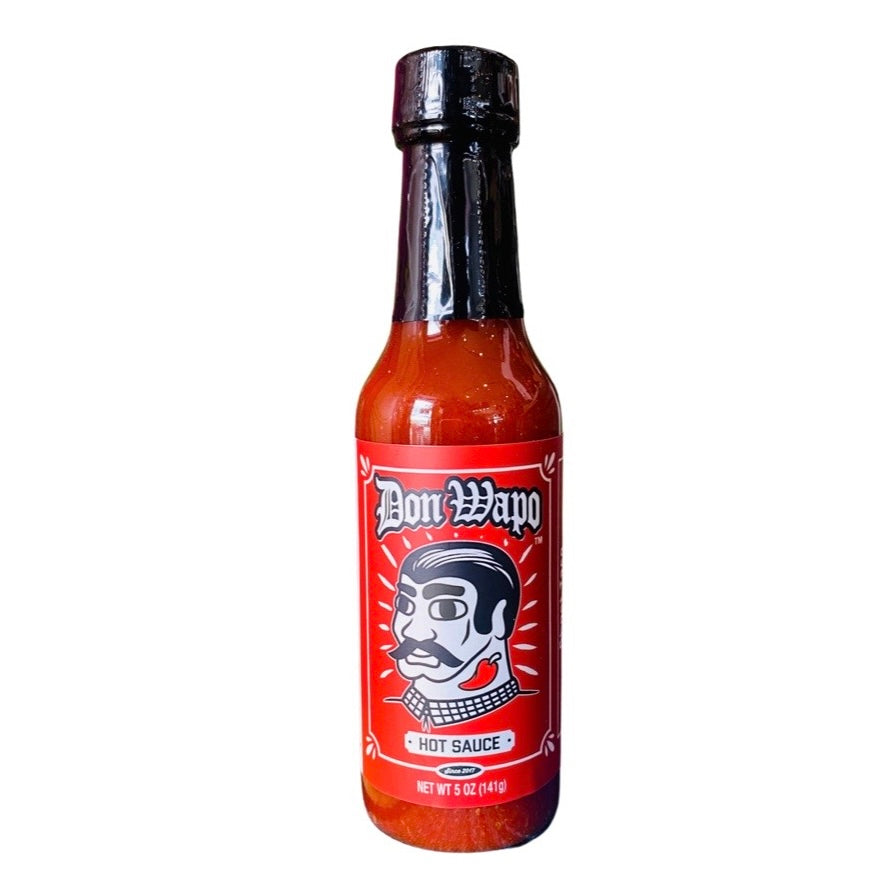 Don Wapo Hot Sauce- Ghost Taco packaged in a clear glass branded bottle.